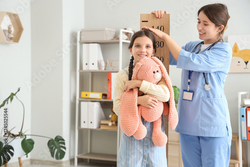 Female pediatrician with st...