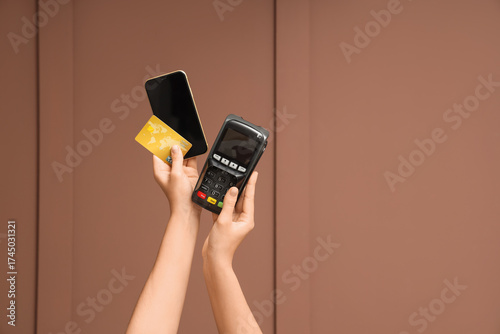 Hands with payment terminal...