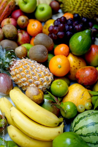 Fresh tropical fruits assortment on white background.