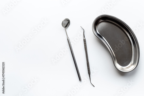 Dental equipment tools for teeth care on white background. Professional Dentist desktop, top view