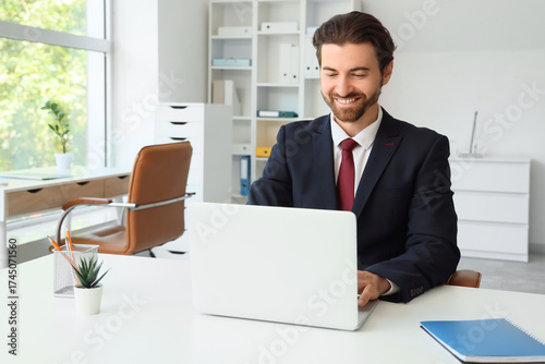 Young male secretary workin...