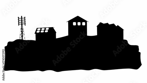 Dramatic silhouette of historic European village buildings on a hill with a communication tower nearby at dusk