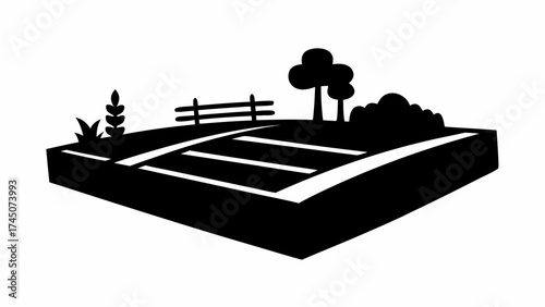 Vibrant farm landscape with cultivated fields, rustic fence, and trees captures rural charm