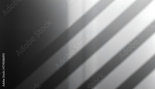 Abstract monochrome image featuring diagonal lines and gradient shading in grayscale tones and textures