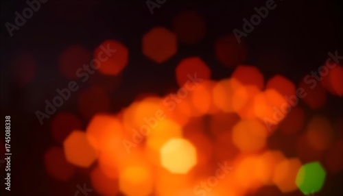 Abstract background of blurred orange and red lights creating a bokeh effect on a dark backdrop