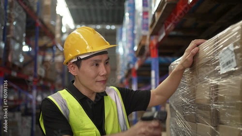 Blue collar worker is working at warehouse. Logistics, transportation.