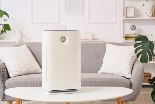 Modern air purifier on coff...