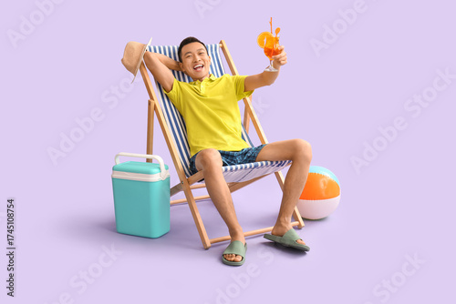 Young Asian man with cockta...