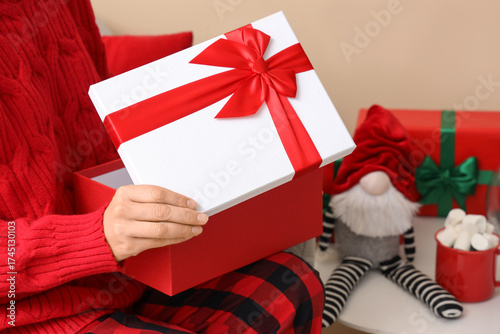 Woman opening beautiful Chr...