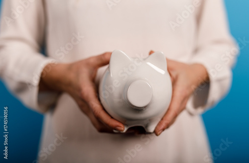 A person is holding a white...