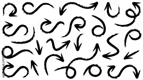 Collection of twenty four black hand drawn arrows pointing in different directions on a white background