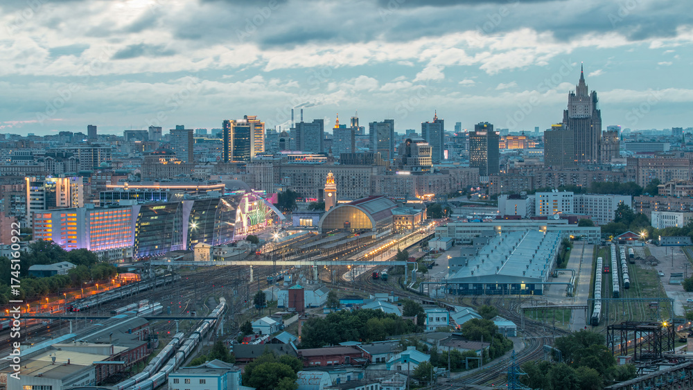 Obraz premium Panoramic view to Kiev Railway Station night to day timelapse and modern city in Moscow, Russia