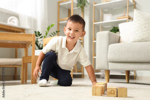 Cute little Asian boy playi...