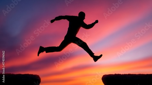 Wallpaper Mural Silhouette of a runner leaping over a gap at sunset with vibrant colors in the sky Torontodigital.ca