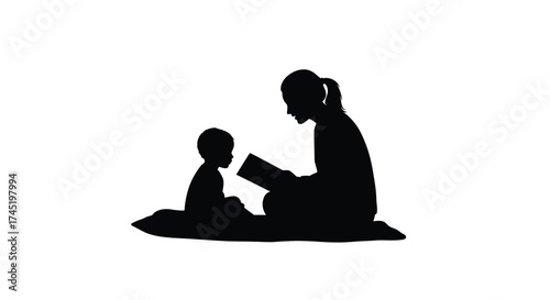 A mother reading a story to her young child in silhouette