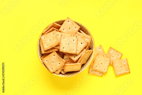 Crispy square crackers in y...