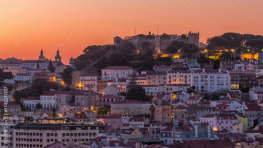 Fototapeta premium Lisbon aerial cityscape skyline night to day timelapse from viewpoint of St. Peter of Alcantara, Portugal