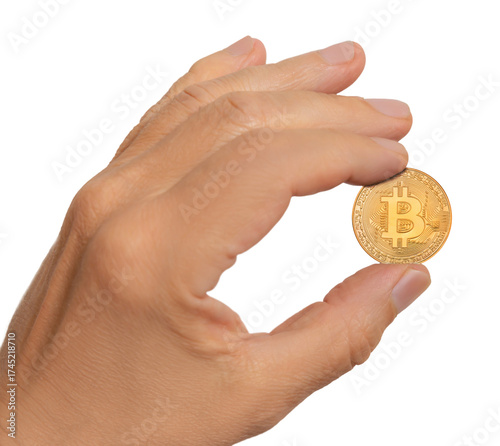 Hand holding a shiny bitcoin coin with clear details in bright lighting