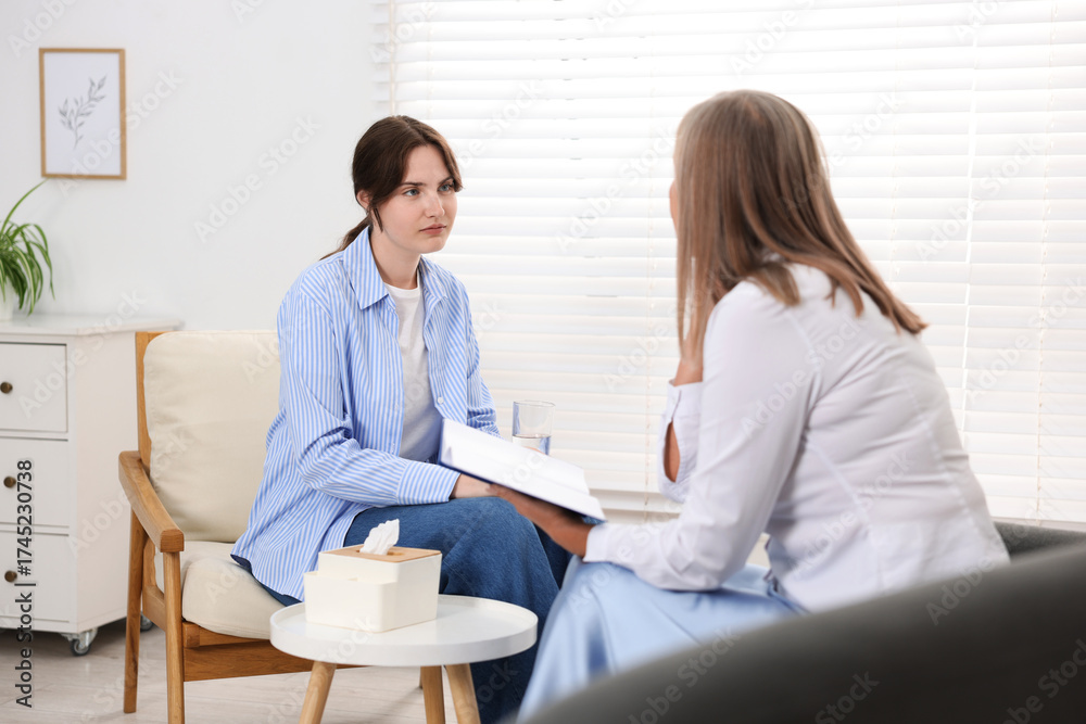Fototapeta premium Professional psychotherapist working with patient in office