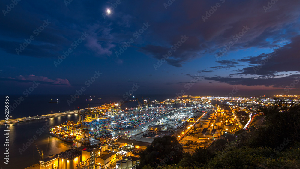 Fototapeta premium Seaport and loading docks at the port with cranes and multi-colored cargo containers day to night timelapse