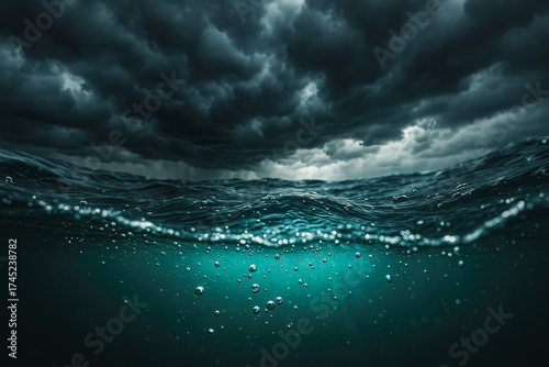 Split-level ocean view with bubbles under teal water and storm clouds above; dramatic mood. generative AI