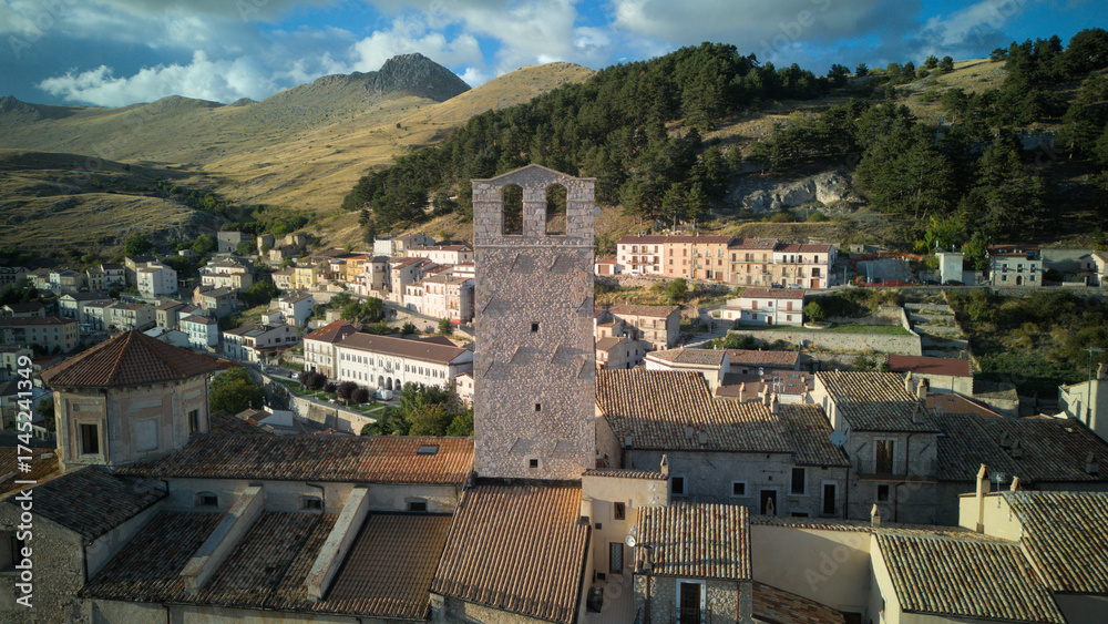 Obraz premium Drone aerial view of Castel del Monte, Abruzzo, a medieval hilltop village with ancient stone architecture and panoramic landscapes