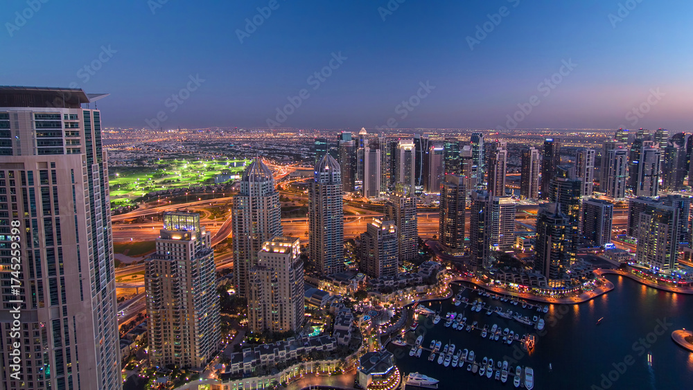 Fototapeta premium Dubai Marina with yachts day to night aerial timelapse