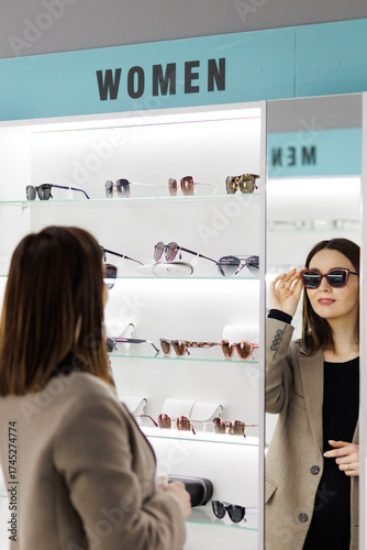 Choosing the perfect sunglasses in a stylish eyewear store