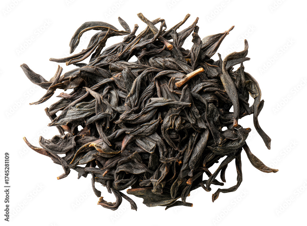 Obraz premium Dark, dried leaves, possibly tea leaves, form a textured, circular heap against black backdrop