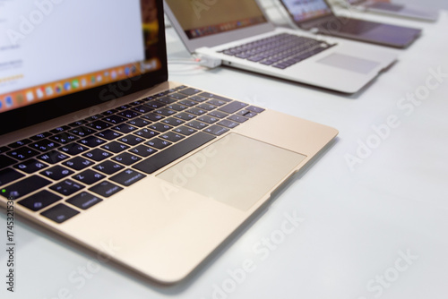 A laptops on the counter in an electronics store
