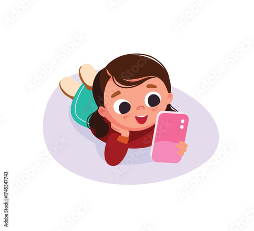 Child girl lying down chatting, messaging using smartphone, gadget, communicating through social network, social media. Digital addiction, social media dependence. Kid watching videos on internet 