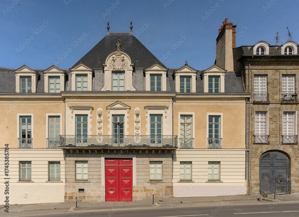Fototapeta premium Neo-classical apartment buidling with sculpted decoration of lions on a sunny day in Rennes, France 