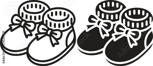 Cute baby booties with ribbons in black and white