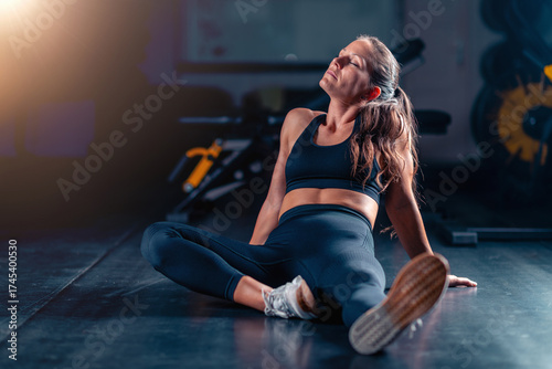 Photos Resting after a gym workout, a woman fosters muscle recovery and mental clarity