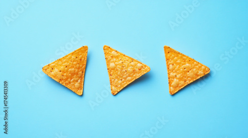 Tortilla Chips Arranged on Bright Blue Background