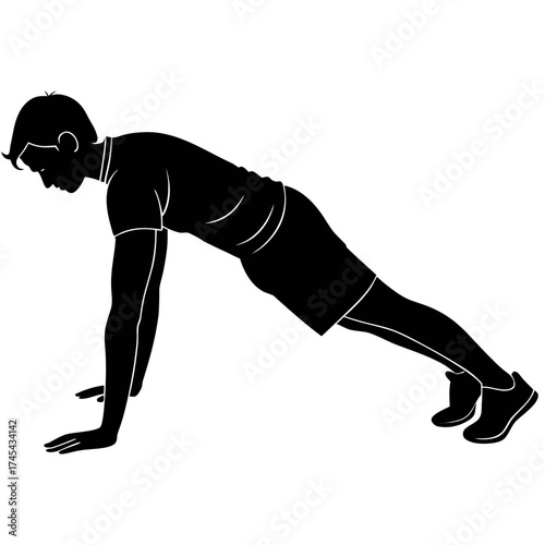 Silhouette of a man performing a push up exercise in a fitness workout routine