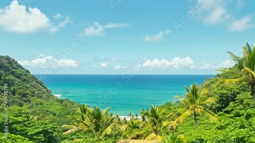 Stunning Tropical Ocean View from Modern Glass Balcony with Lush Greenery and Blue Sky.