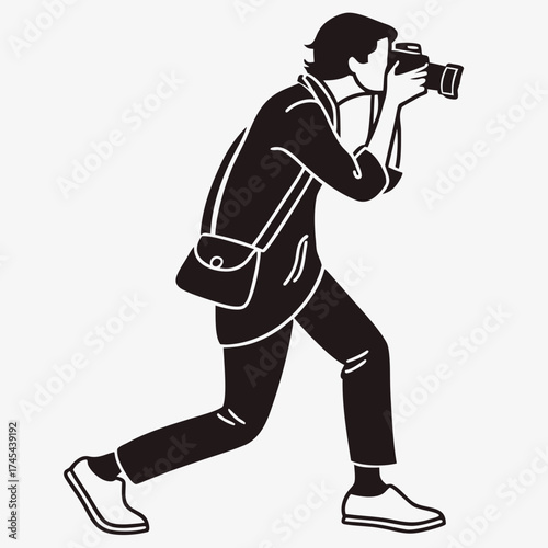 Silhouette of a person in motion actively capturing a photograph with a camera and a shoulder bag