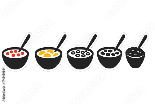 Collection of breakfast food bowls with cereal, oatmeal, fruit, milk, and spoons