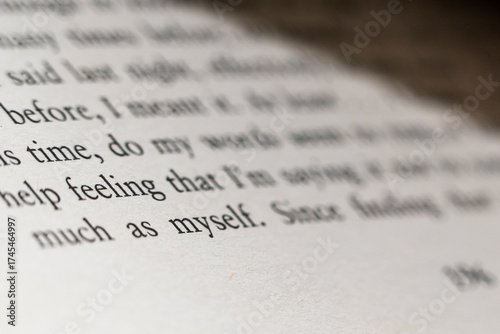Close-up of a printed page with a quote about self-reflection and personal feelings in soft focus