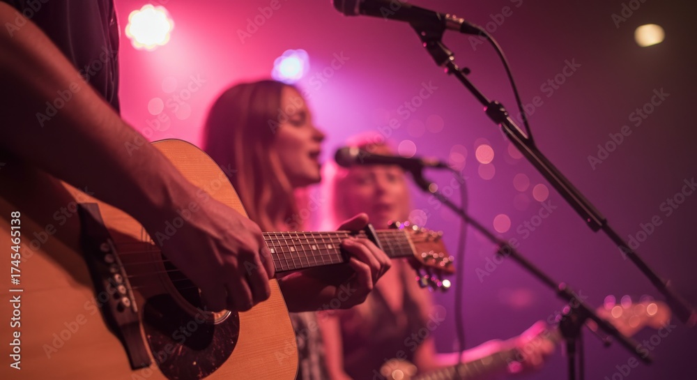 Naklejka premium Musicians perform with guitars and microphones on stage.
