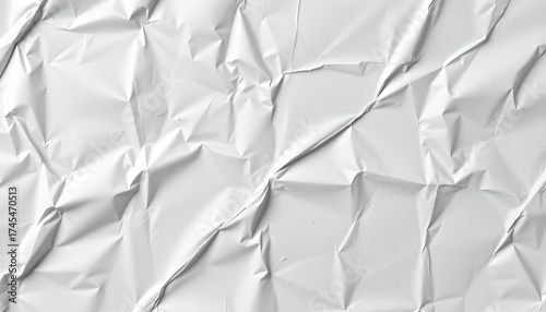 A crumpled silver aluminum foil with light reflecting off it, against a muted, blurred background that doesn't provide any distinct information.