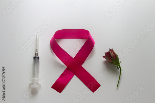 Emblem for World AIDS Day, syringe, red rose bud. On a white background.