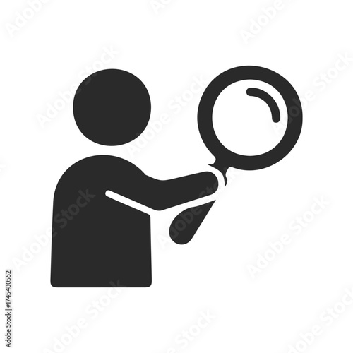 Silhouette of person holding magnifying glass icon for search or investigation