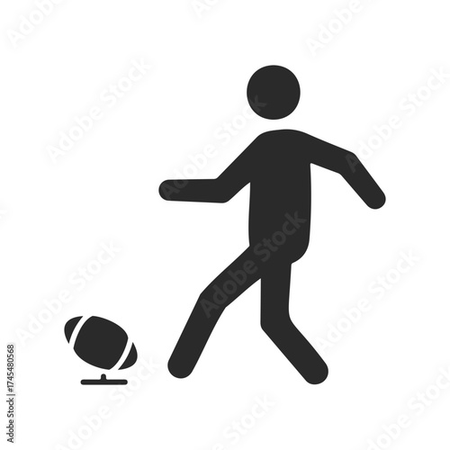 Silhouette of a person kicking football on stand symbol