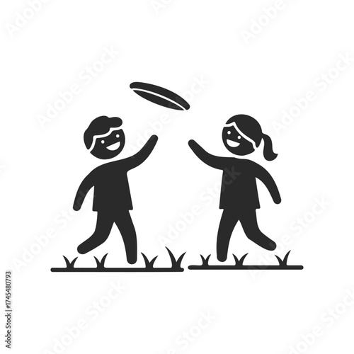 Silhouette of young caucasian children playing frisbee outdoors