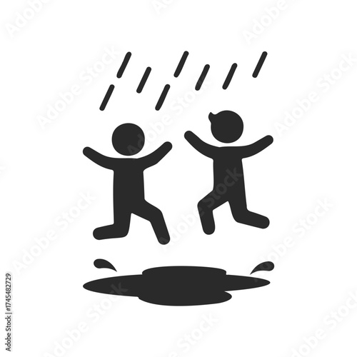 Silhouette of young children joyfully jumping in puddle under rain