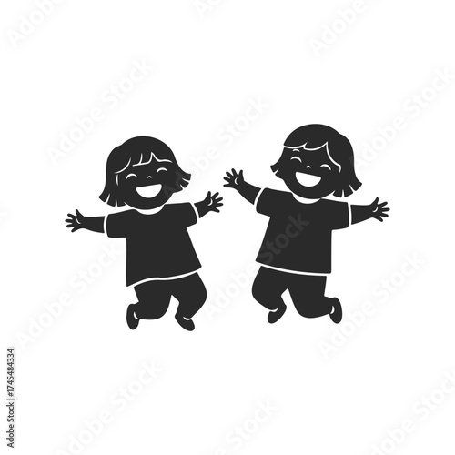 Happy silhouette of two young caucasian children jumping with joy