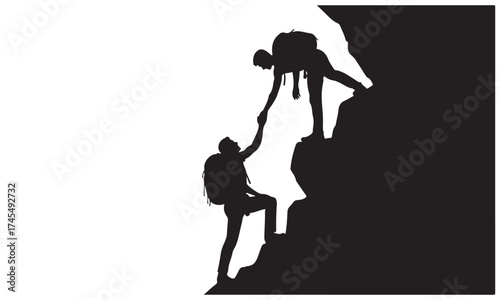 Silhouettes of Climbers Offering a Helping Hand on Mountain Ascent