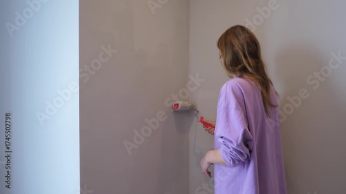 Girl Painting Wall at Home 
